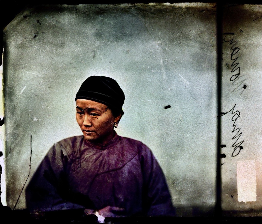 The same Amoy portrait repaired, colorized and face-protected with natural tones