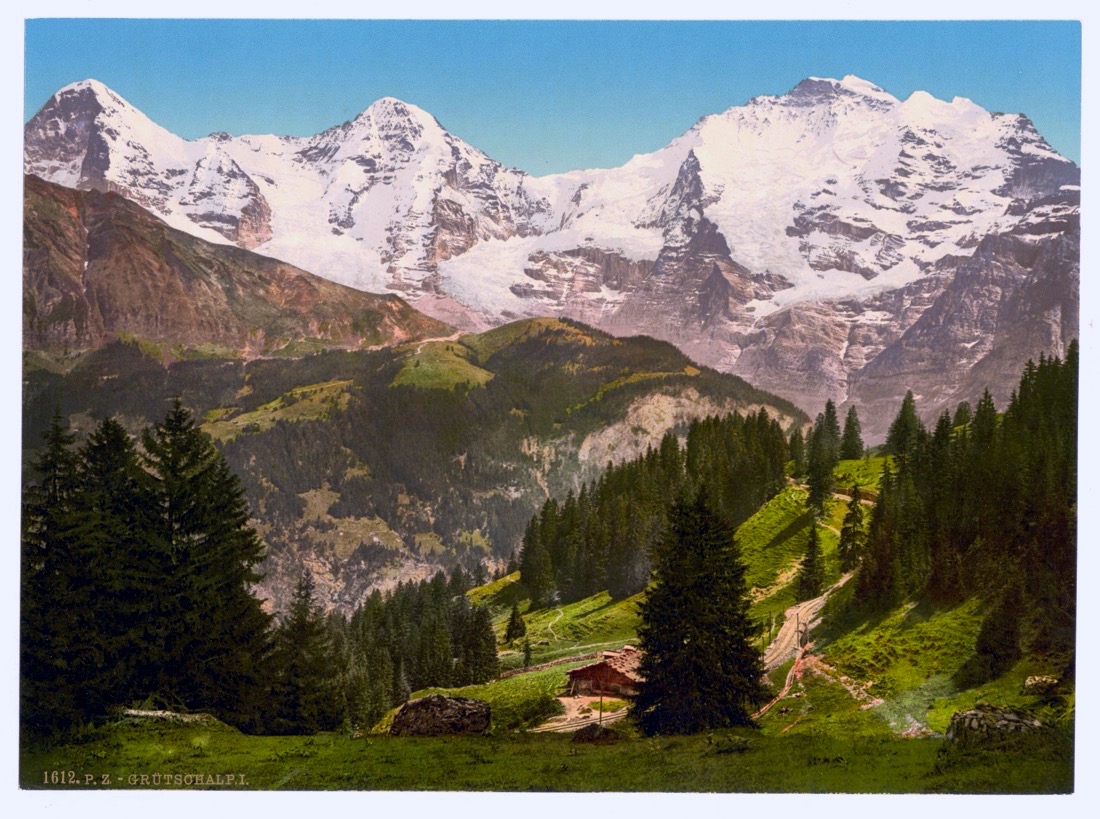 The same Alpine photochrom with its colour revived — a green valley beneath snow-capped peaks