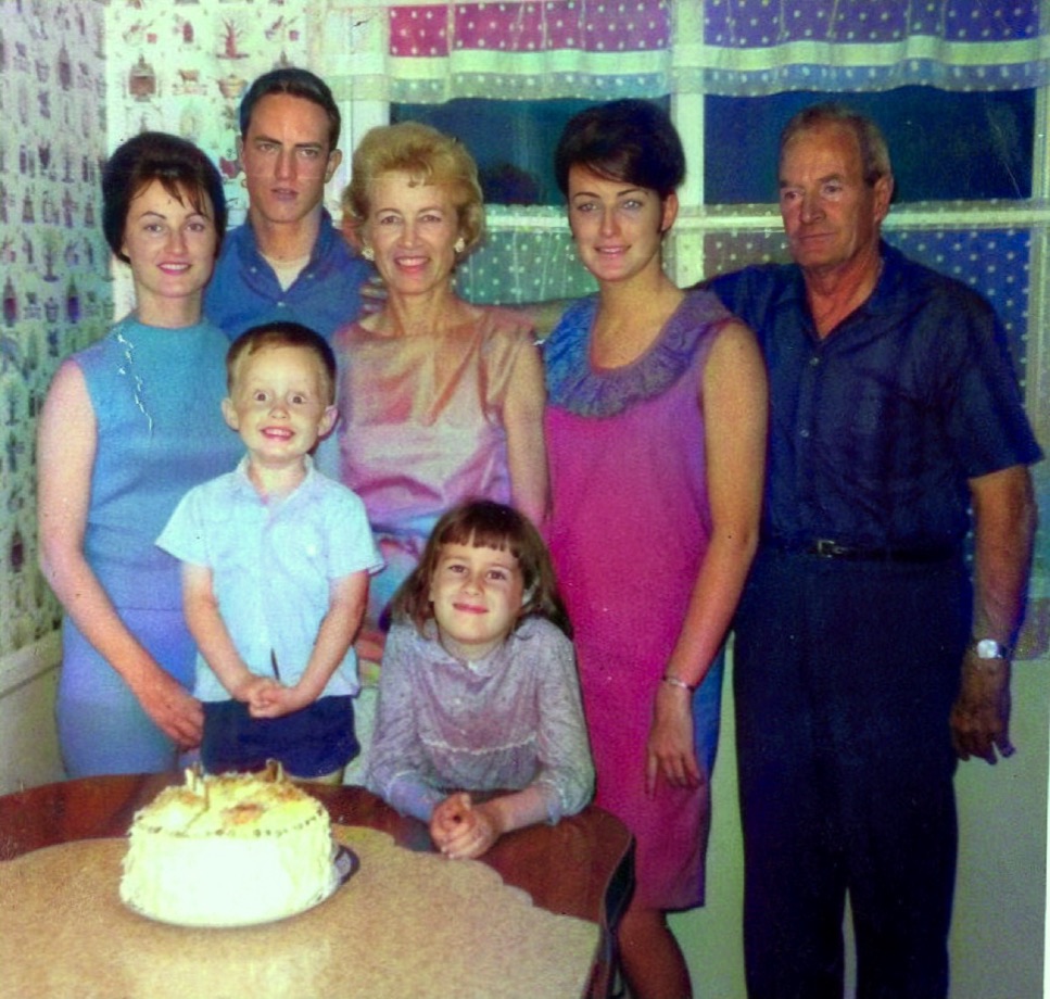 The same 1965 family photo colorized, with 1960s clothing colours and warm skin tones