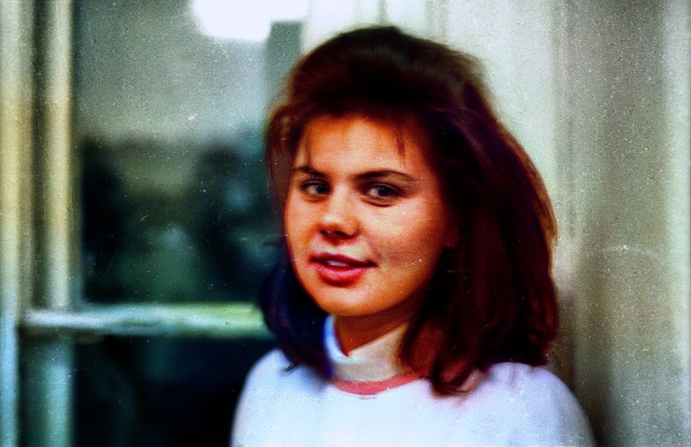 The same Fortepan portrait repaired and colorized with natural skin tones and protected face details