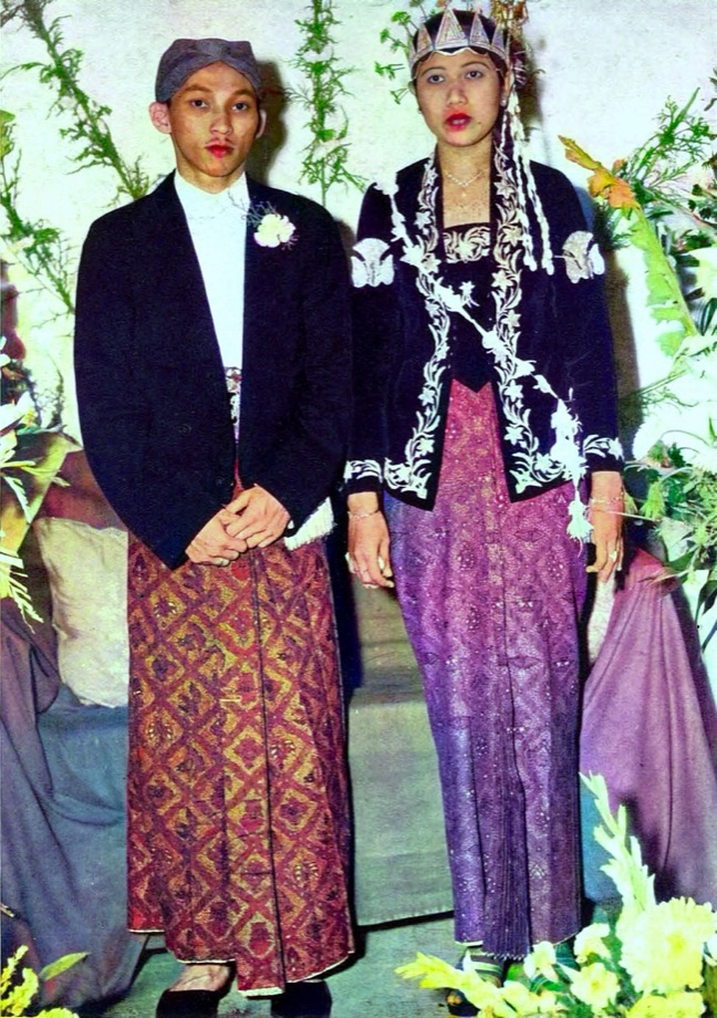 The same 1953 Javanese wedding colorized, with rich batik reds and golds