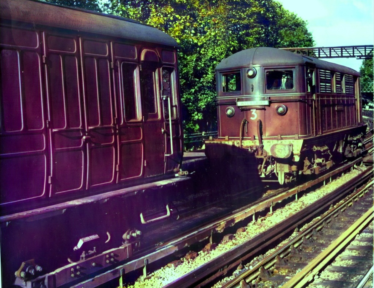 The same 1961 railway scene colorized, with natural metal, foliage and sky