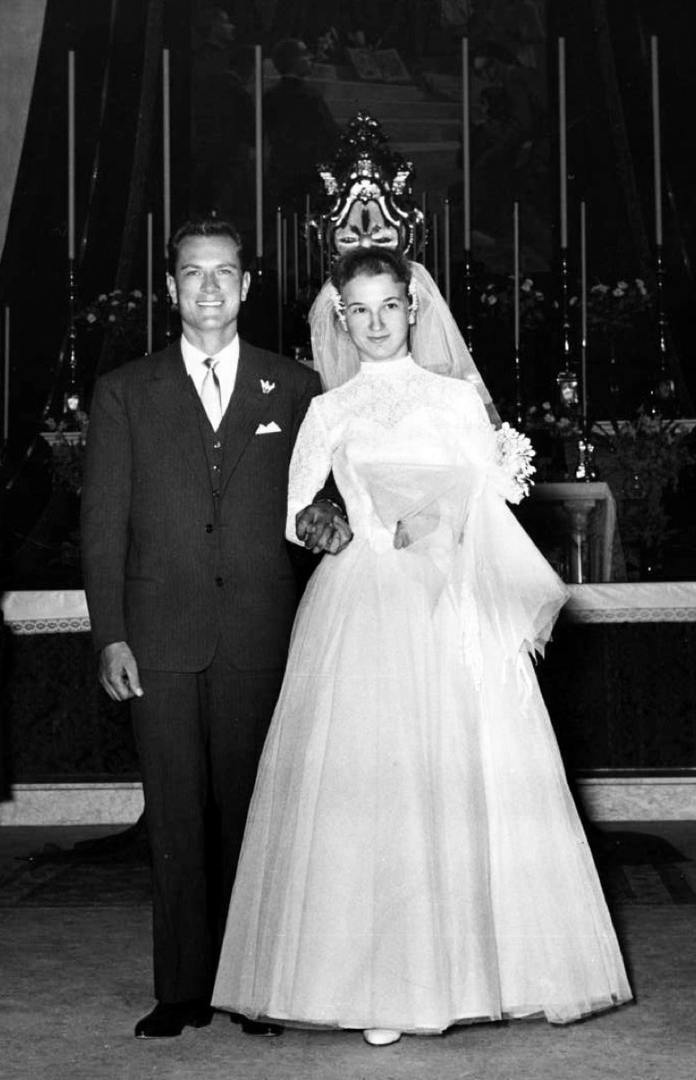 A black-and-white 1957 Italian wedding portrait of a bride and groom