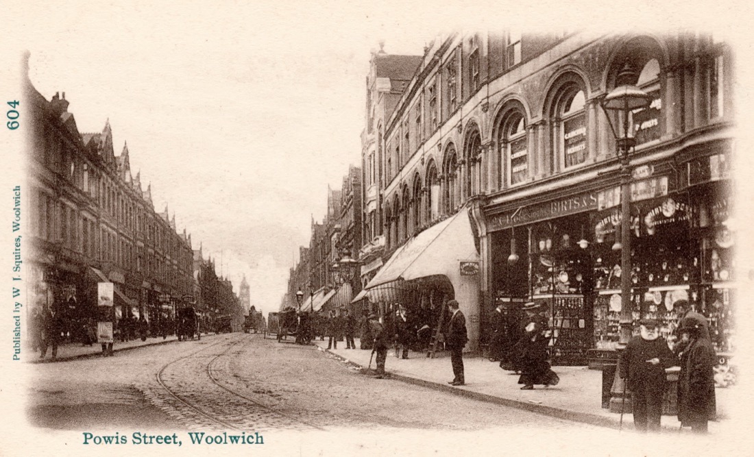 A black-and-white photograph of Powis Street, Woolwich, London around 1900